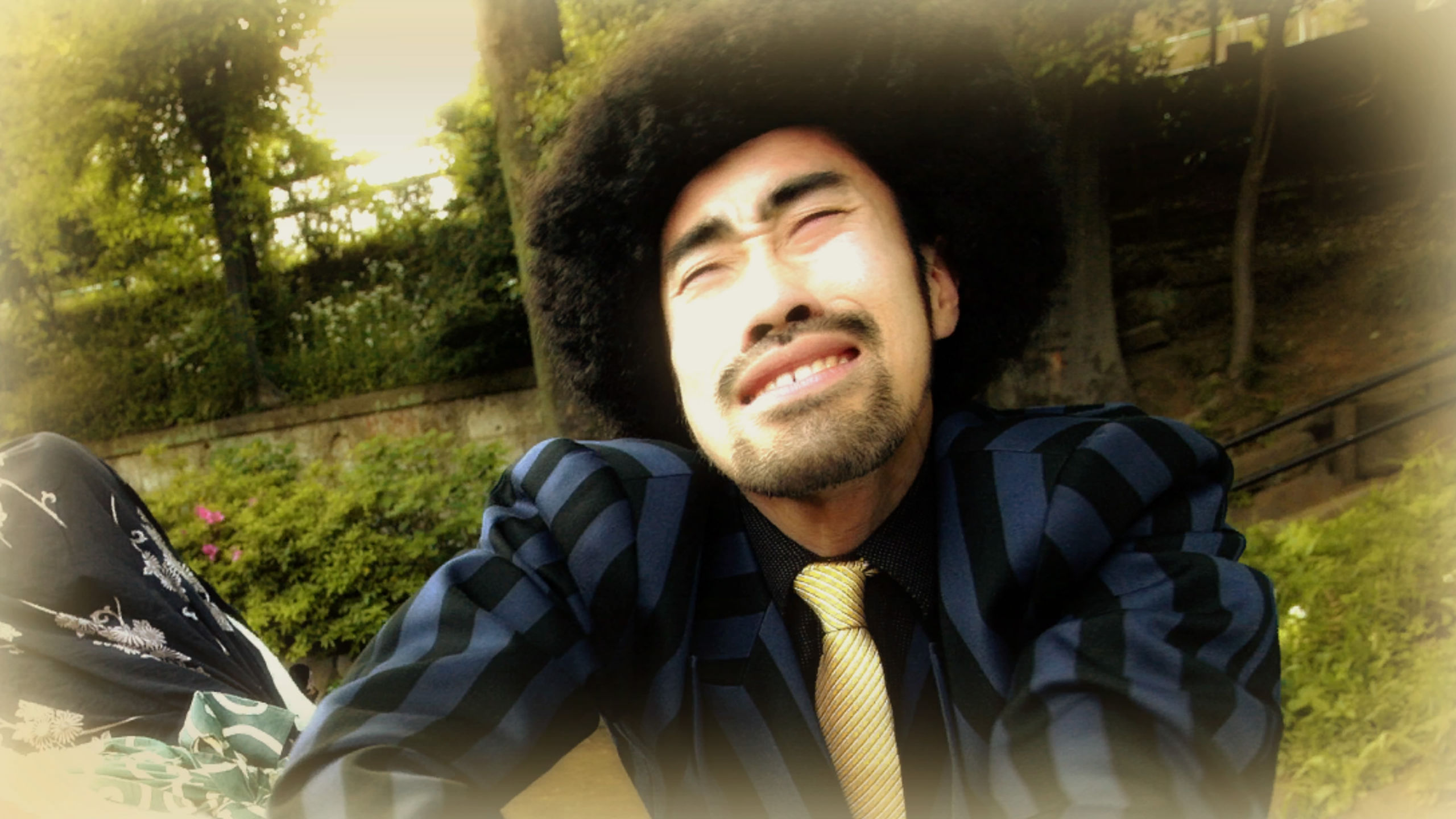 428 Shibuya Scramble Gallery Preview. A man with an afro squinting
